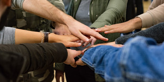 Come2Campus different hands on top of each other