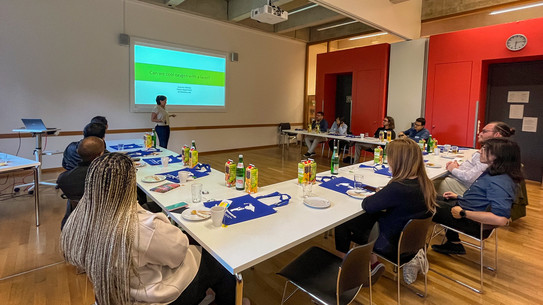 researchers listening to a scientific presentation