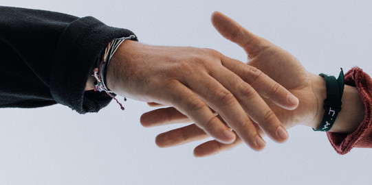 Reaching hands Two hands are touching each other